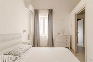 A bed or beds in a room at La Casa di Nonna