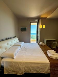 Postel nebo postele na pokoji v ubytování B&B L'Orizzonte