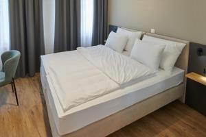 Hotel Jäger Jeuss - Murten - Self-Check-in客房内的一张或多张床位
