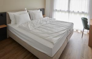 Hotel Jäger Jeuss - Murten - Self-Check-in客房内的一张或多张床位