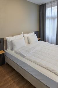 Hotel Jäger Jeuss - Murten - Self-Check-in客房内的一张或多张床位