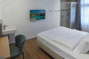 Hotel Jäger Jeuss - Murten - Self-Check-in客房内的一张或多张床位
