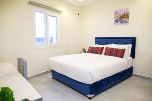 Rúm í herbergi á NASEEM HOTEL