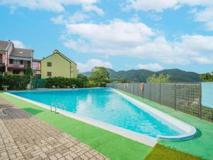 a swimming pool in a yard with a fence at casa vacanze Veronica in Soviore