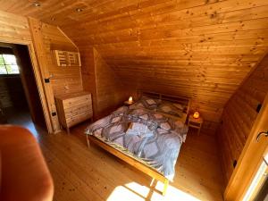 an overhead view of a bed in a wooden cabin at Loghouse Brunka - Escape from life on a highway in Gornja Radgona +18 photos