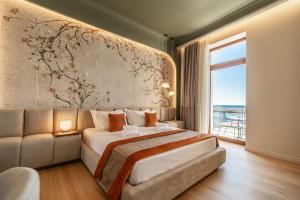 Postel nebo postele na pokoji v ubytování MiraVita Boutique Hotel - Adults Only