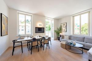 a living room with a table and a couch at Villa Porto Rapallo Portofino Coast in Rapallo