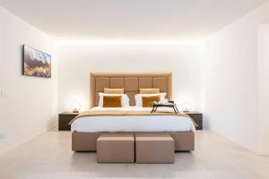 a bedroom with a large bed and two tables at Villa Porto Rapallo Portofino Coast in Rapallo