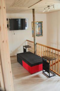 a room with a bed with a tree in it at Castillo in Ensheim