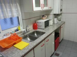 A kitchen or kitchenette at Dreams Apartments