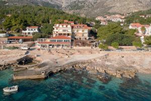 an aerial view of a town with a bridge over the water at Apartments Spila Beach in Ivan Dolac