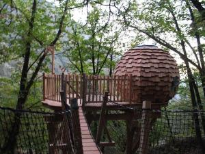 a small playground with a large object in the trees at Les Ecrins de Belvedere in Belvédère