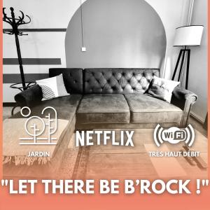 a couch sitting in a living room with avertisement for at Le B'Rock in Liévin