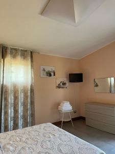 a bedroom with a bed and a television in it at ROOM365 in Lanciano