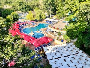 an overhead view of a large swimming pool with umbrellas at BSA Holiday Park Hotel - All Inclusive in Golden Sands