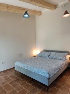 מיטה או מיטות בחדר ב-Agriturismo Al posto giusto