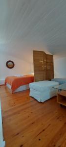 a bedroom with two beds and a wooden floor at Pefkohori Pegasus MoodSolutions Living in Pefkohori
