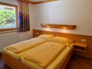 Posteľ alebo postele v izbe v ubytovaní Alpenpension Gastein