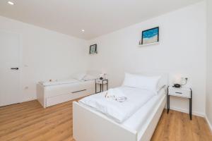 Postel nebo postele na pokoji v ubytování Villa Laganini Apartment 2&4
