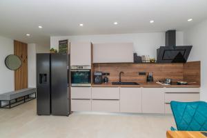 Kuchyň nebo kuchyňský kout v ubytování Villa Laganini Apartment 2&4