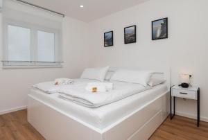 Postel nebo postele na pokoji v ubytování Villa Laganini Apartment 2&4