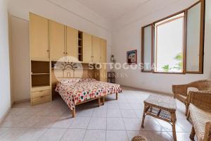 Ένα ή περισσότερα κρεβάτια σε δωμάτιο στο Bellavista Flat- San Foca +11 φωτογραφίες