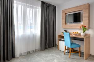 TV a/nebo společenská místnost v ubytování Martinez Hotel All Inclusive