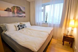 מיטה או מיטות בחדר ב-City Comfort Apartments