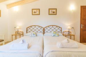 Ein Bett oder Betten in einem Zimmer der Unterkunft Can Ferrer