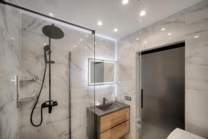 a bathroom with a shower and a sink at Cannes Luxury Rental - Stunning apartment with terrace to rent Grand Hotel in Cannes