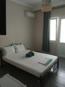 Postel nebo postele na pokoji v ubytování Iordanis