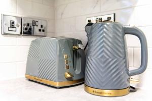 a toaster sitting on top of a kitchen counter at Glasswing Stays Margaret st, central Sheffield in Sheffield
