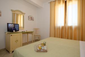 TV a/nebo společenská místnost v ubytování Blue Sea B&b
