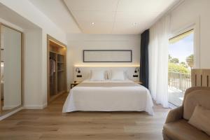 Postel nebo postele na pokoji v ubytování Hotel Rovira