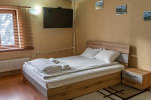 Postel nebo postele na pokoji v ubytování Zvezditsa Chalet