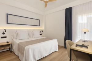 Postel nebo postele na pokoji v ubytování Hotel Rovira