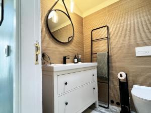 a bathroom with a sink and a mirror at Patio Canario * Beach Escape / 2 rooms, 2 terraces & pool in Arona +42 photos