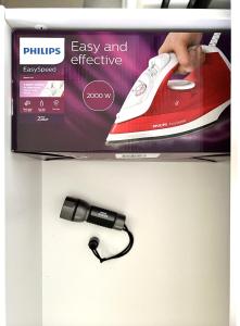 a electronic device is hanging on a shelf at Patio Canario * Beach Escape / 2 rooms, 2 terraces & pool in Arona