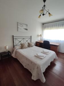 A bed or beds in a room at DÚPLEX SANABRIA