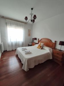 A bed or beds in a room at DÚPLEX SANABRIA