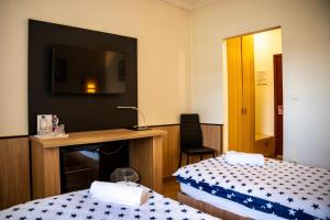 Posteľ alebo postele v izbe v ubytovaní Hotel Bolero
