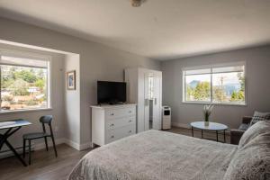 Ένα ή περισσότερα κρεβάτια σε δωμάτιο στο Gibsons Landing Inn