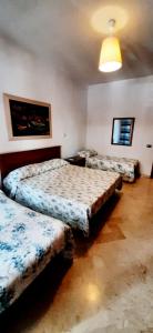 Postel nebo postele na pokoji v ubytování Casa Piacquadio + 29 fotografií