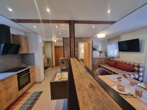 TV a/nebo společenská místnost v ubytování Hotel Gletschermühle