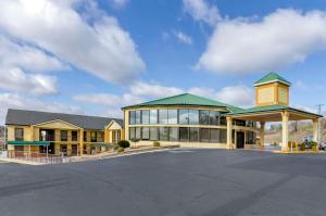 a large building with a parking lot in front of it at Quality Inn Hillsville in Hillsville