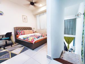 a bedroom with a bed and a desk at AZ Suites 1 @Putrajaya Cyberjaya in Cyberjaya