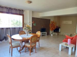 a living room with a table and chairs and a couch at Casa Emilia in Marano Principato