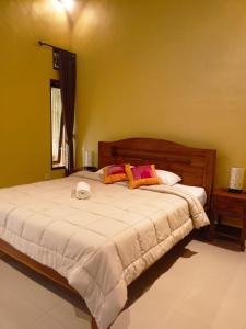 Postel nebo postele na pokoji v ubytování Bali Asli Guest House by EPS