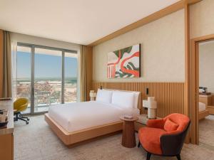 Ένα ή περισσότερα κρεβάτια σε δωμάτιο στο Rixos Premium Qetaifan Island North