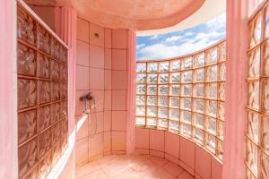 a bathroom with a shower and a window at Paco's Resort Barbie House in Oziás +16 photos